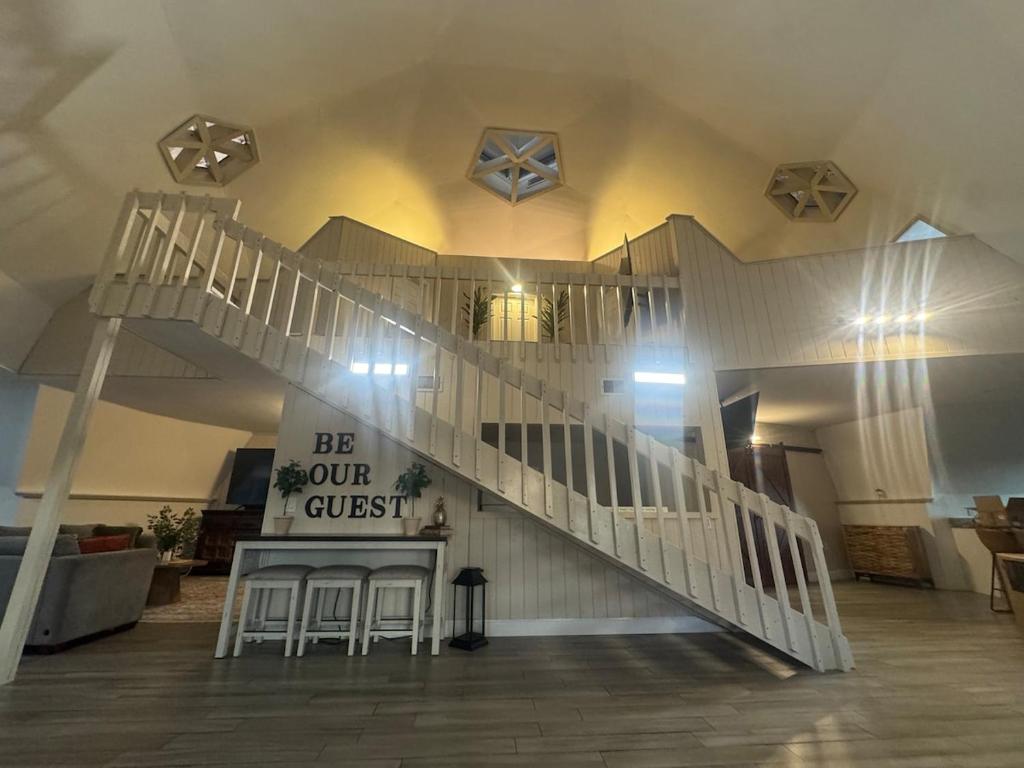 Staircase with Be Our Guest sign inside the dome