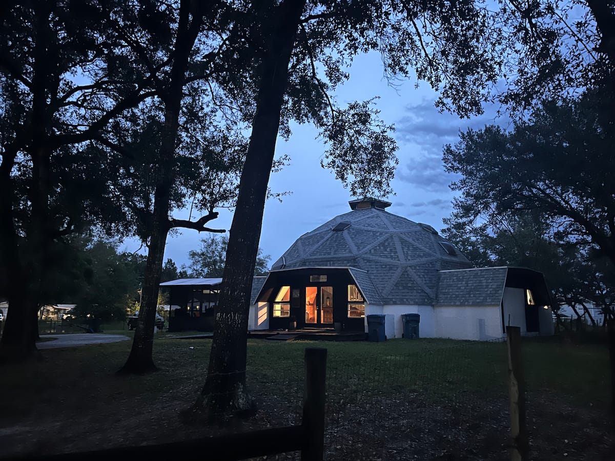 Dome home exterior with parking for bikes and trailers
